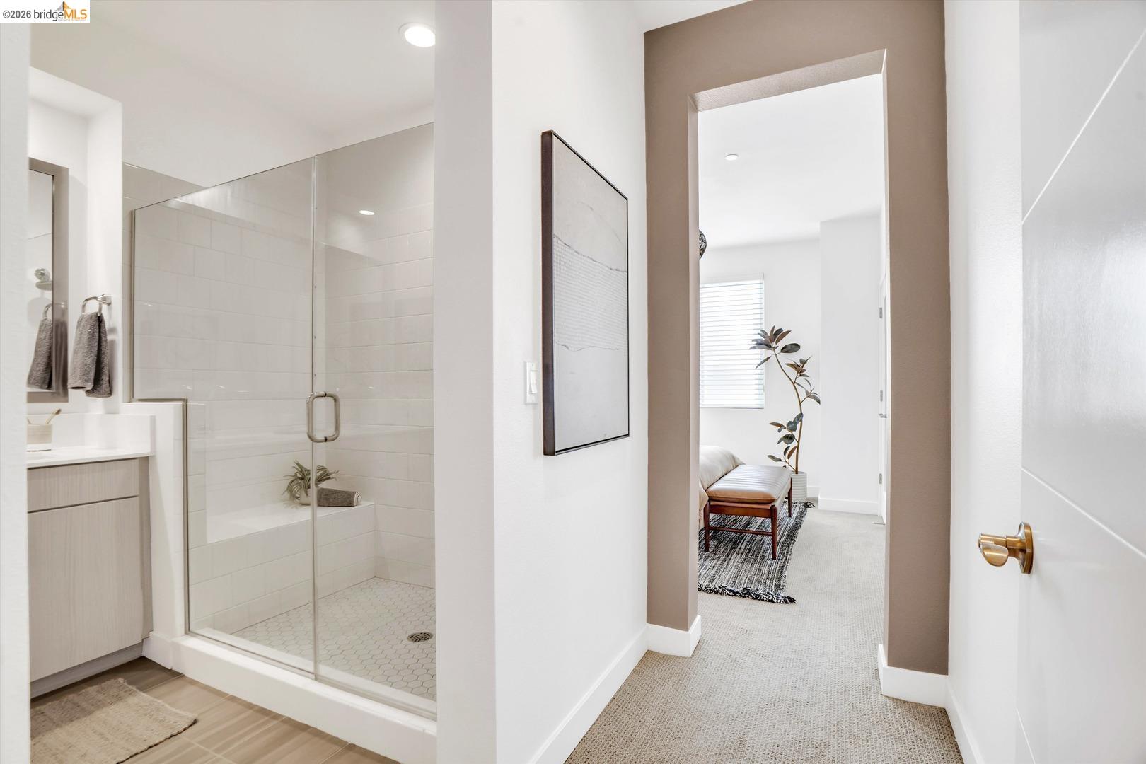 2229 Myrtle Street Oakland, CA 94607 - Photo 15 of 37 ensuite bathroom with vanity, a stall shower, light carpet, and recessed lighting