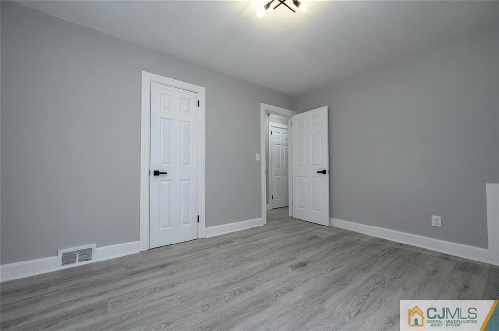 628 Concord Circle Ewing, NJ 08618 - Photo 12 of 48 a view of an empty room with wooden floor