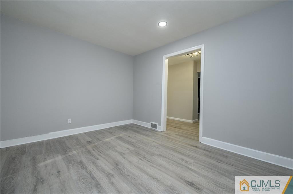 628 Concord Circle Ewing, NJ 08618 - Photo 14 of 48 a view of an empty room with wooden floor