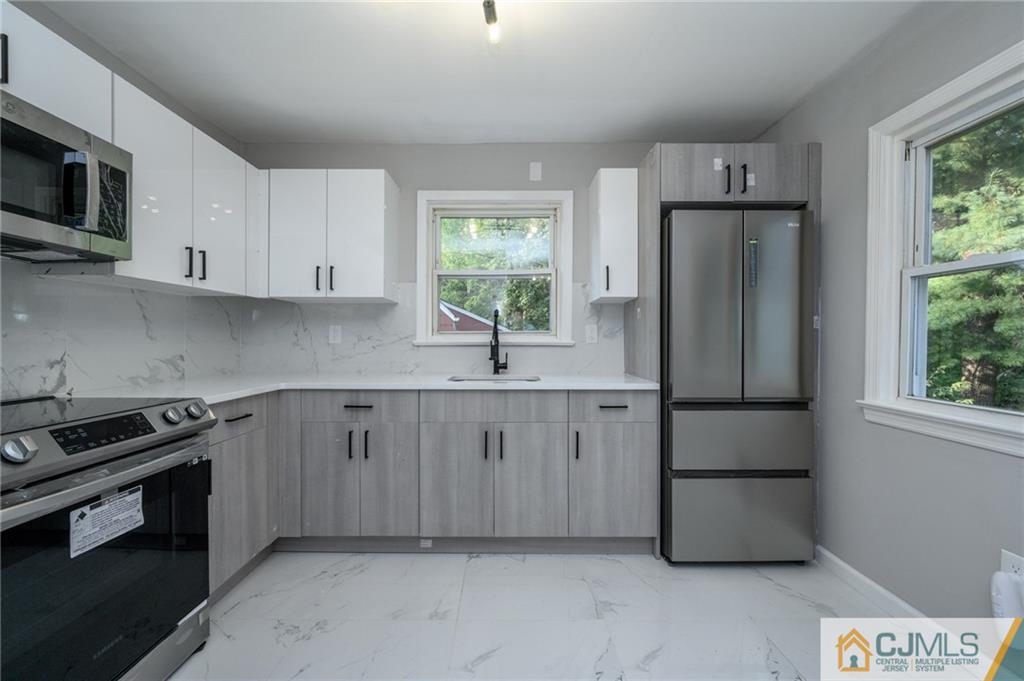 628 Concord Circle Ewing, NJ 08618 - Photo 18 of 48 a kitchen with a sink appliances and cabinets