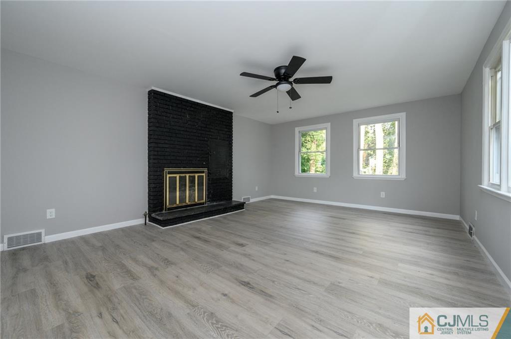 628 Concord Circle Ewing, NJ 08618 - Photo 21 of 48 a view of an empty room with a window and wooden floor