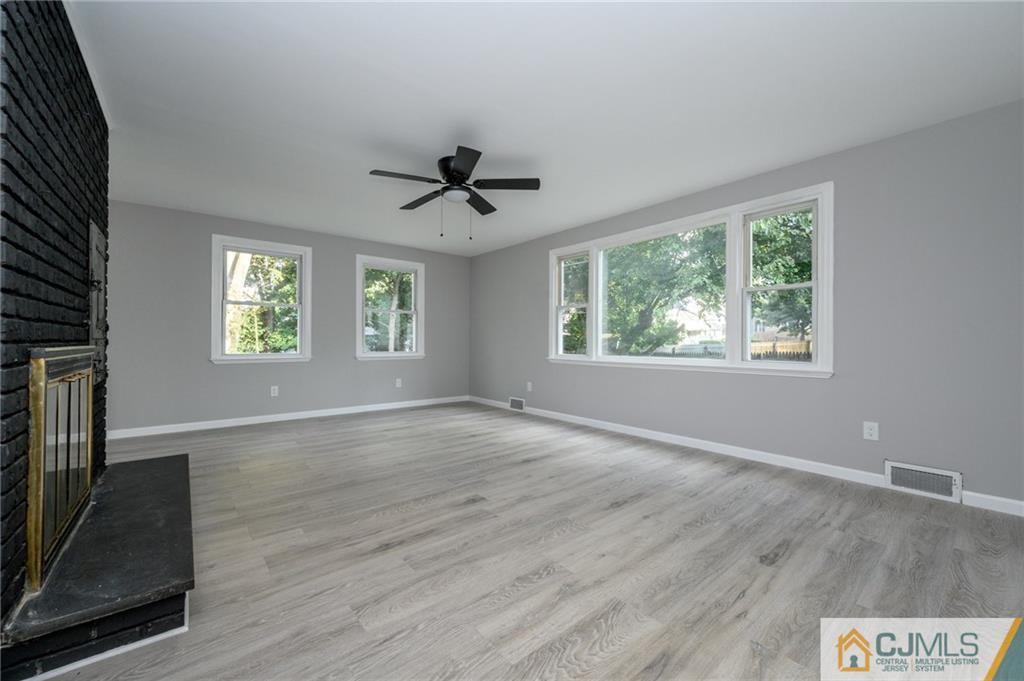 628 Concord Circle Ewing, NJ 08618 - Photo 24 of 48 a view of an empty room with a window and wooden floor