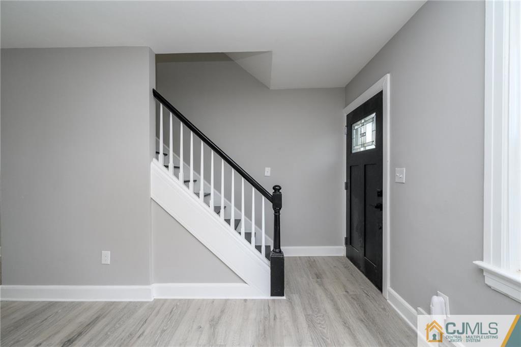 628 Concord Circle Ewing, NJ 08618 - Photo 26 of 48 a view of hallway with wooden floor and stairs