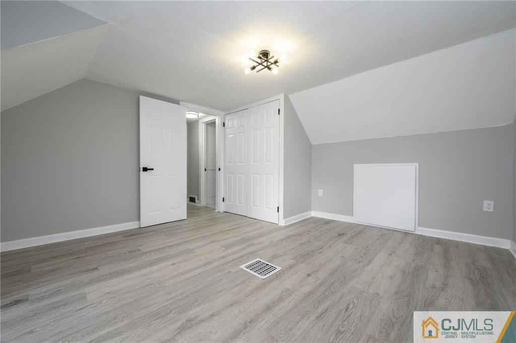 628 Concord Circle Ewing, NJ 08618 - Photo 29 of 48 a view of an empty room with wooden floor and a ceiling fan