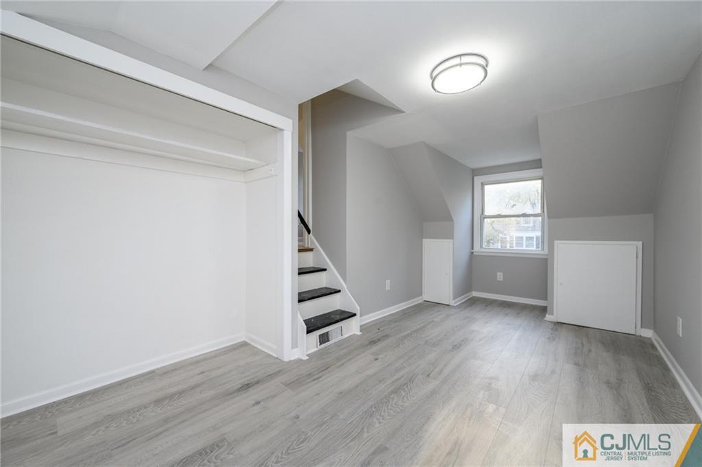 628 Concord Circle Ewing, NJ 08618 - Photo 36 of 48 wooden floor in an empty room with a window