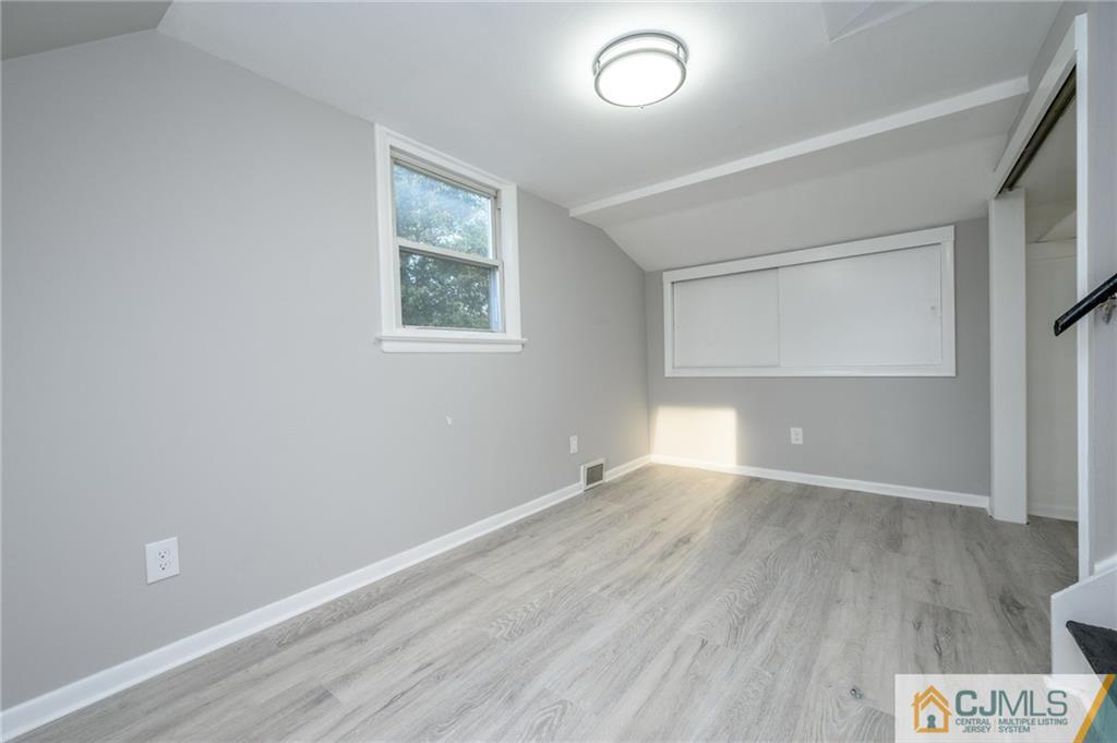 628 Concord Circle Ewing, NJ 08618 - Photo 38 of 48 an empty room with wooden floor and windows