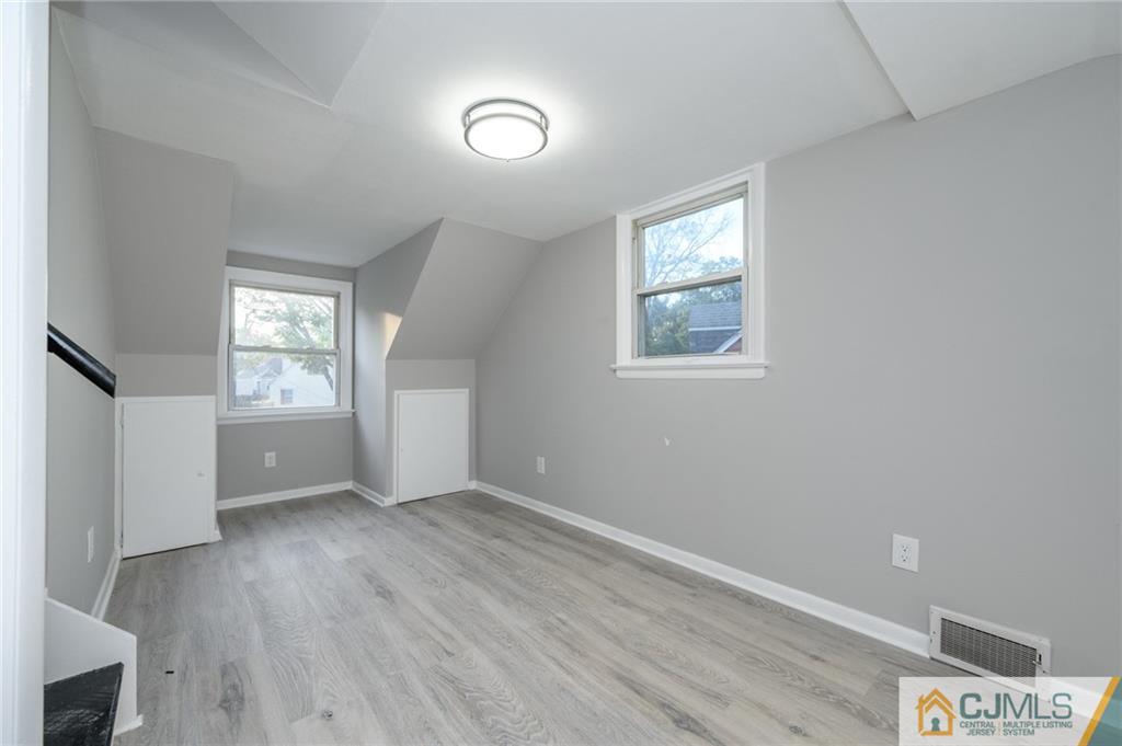 628 Concord Circle Ewing, NJ 08618 - Photo 39 of 48 an empty room with wooden floor and windows