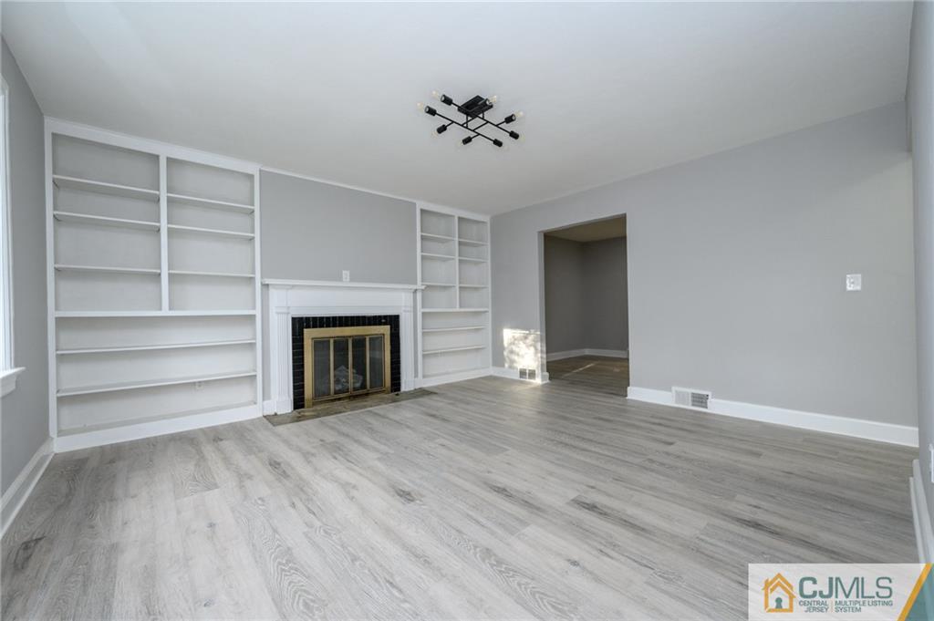 628 Concord Circle Ewing, NJ 08618 - Photo 4 of 48 a view of an empty room with a fireplace and a window