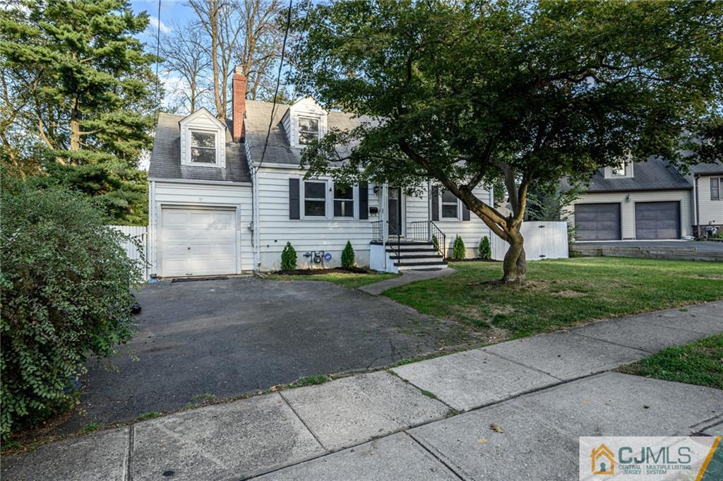 628 Concord Circle Ewing, NJ 08618 - Photo 48 of 48 a view of a white house next to a yard and a large tree