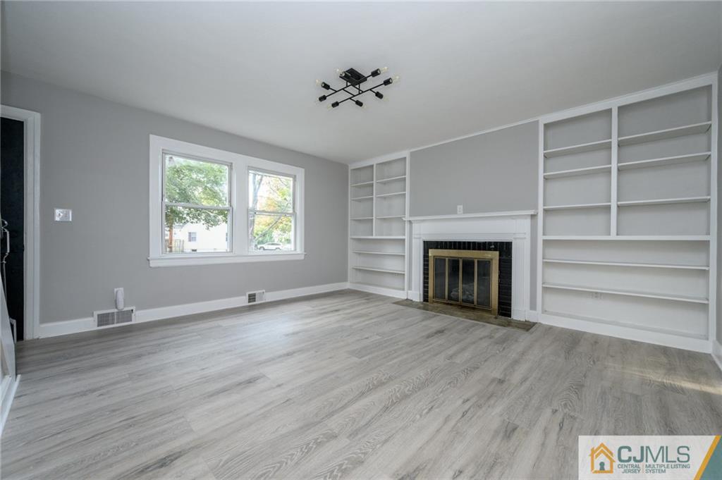 628 Concord Circle Ewing, NJ 08618 - Photo 5 of 48 a view of an empty room with a fireplace and a window