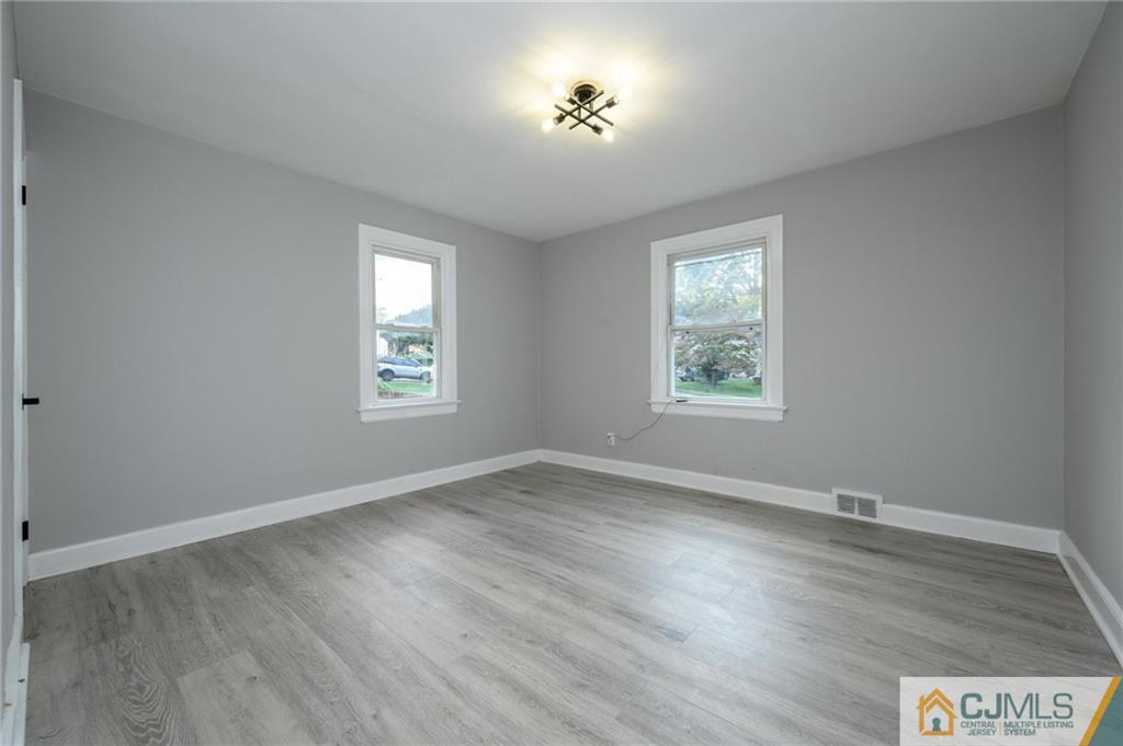 628 Concord Circle Ewing, NJ 08618 - Photo 9 of 48 an empty room with wooden floor and windows
