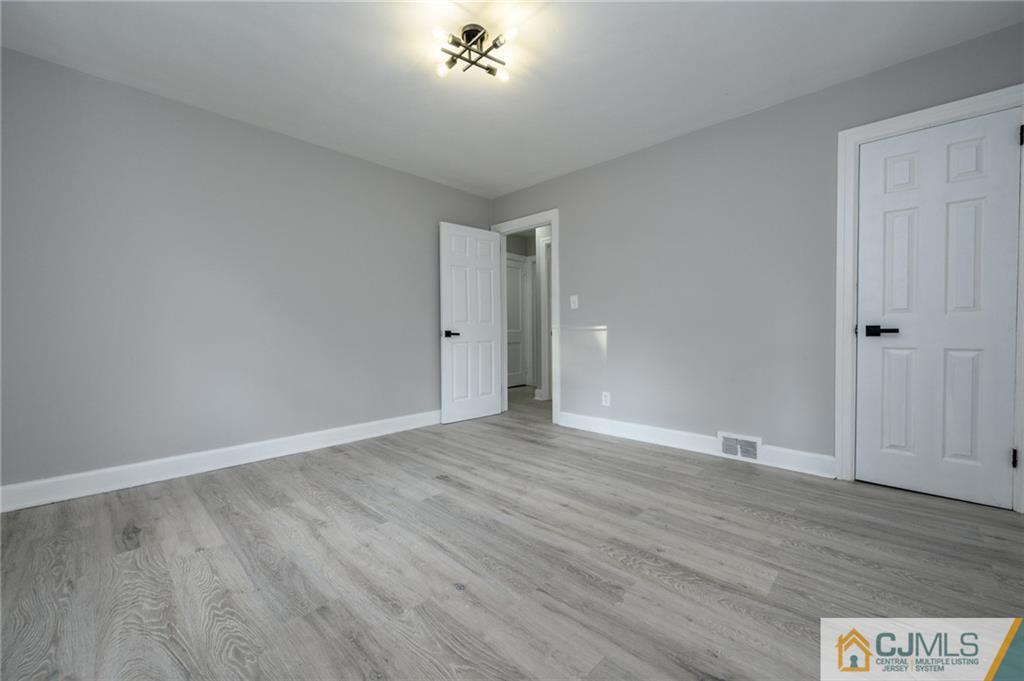 628 Concord Circle Ewing, NJ 08618 - Photo 10 of 48 a view of an empty room with wooden floor