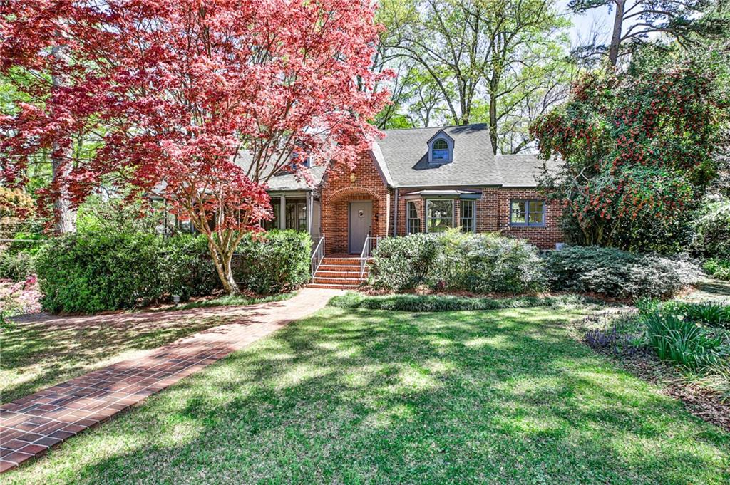 1753 Johnson Road Northeast Atlanta, GA 30306 - Photo 1 of 1 a front view of a house with a garden