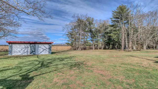 a view of a backyard of the house