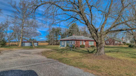 a view of a trees in front of a house