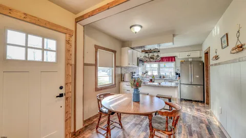 a kitchen with refrigerator and cabinets