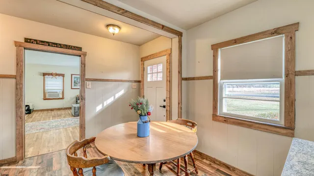 a dining room with furniture and window
