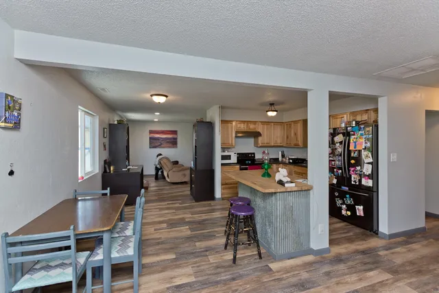 a view of a kitchen and dining room