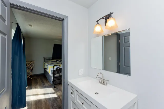 a en suite bathroom with a sink and mirror