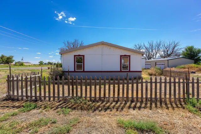 a kitchen with sink refrigerator and window