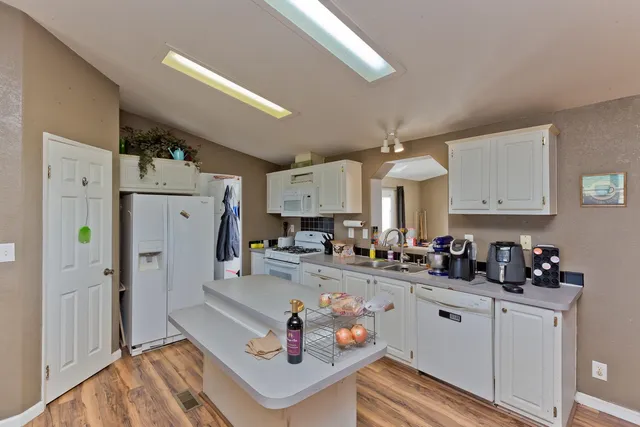 a living room with pool table and windows