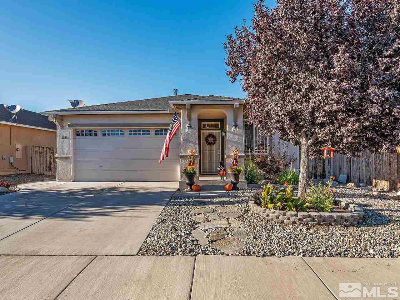 2289 Rio Lobo Lane Reno, NV 89521 - Photo 1 of 17 a front view of a house with garden