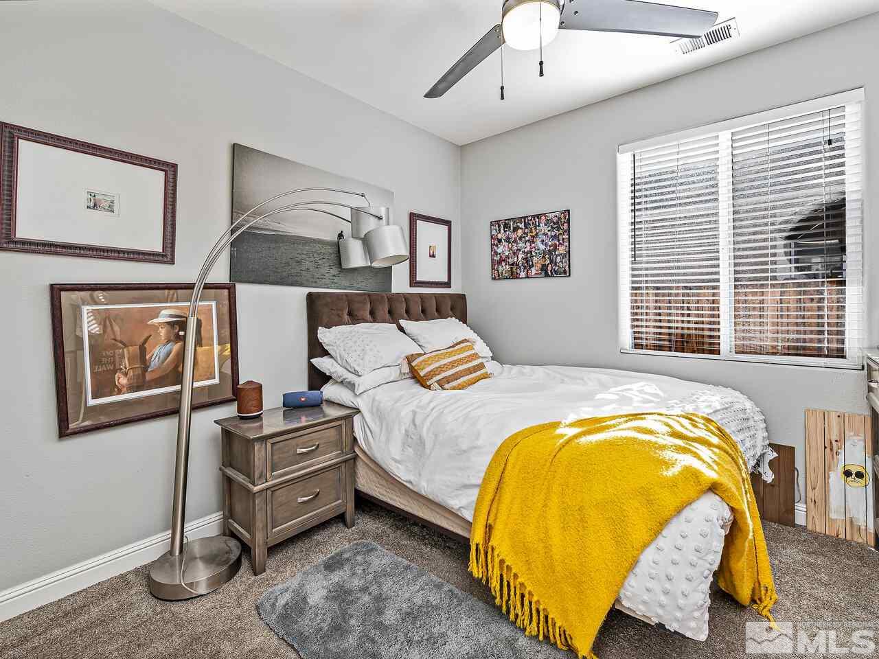 2289 Rio Lobo Lane Reno, NV 89521 - Photo 11 of 17 a bedroom with a bed and wooden floor