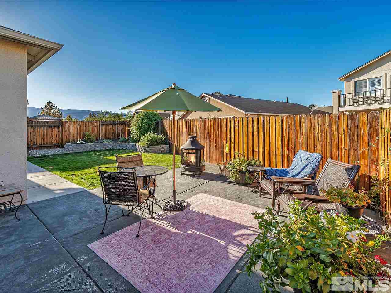 2289 Rio Lobo Lane Reno, NV 89521 - Photo 13 of 17 a view of a backyard with sitting area