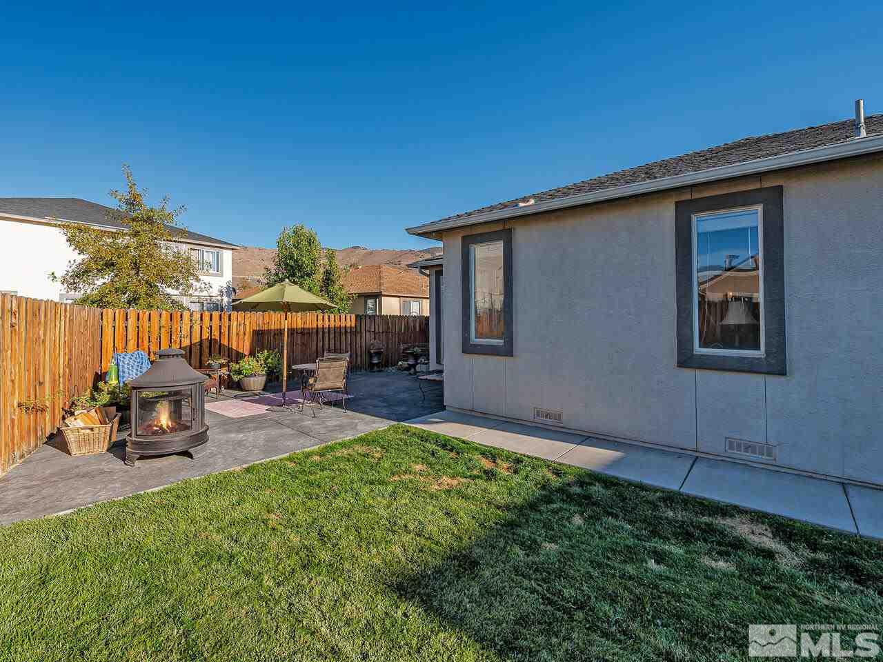 2289 Rio Lobo Lane Reno, NV 89521 - Photo 15 of 17 a view of a house with backyard porch and sitting area