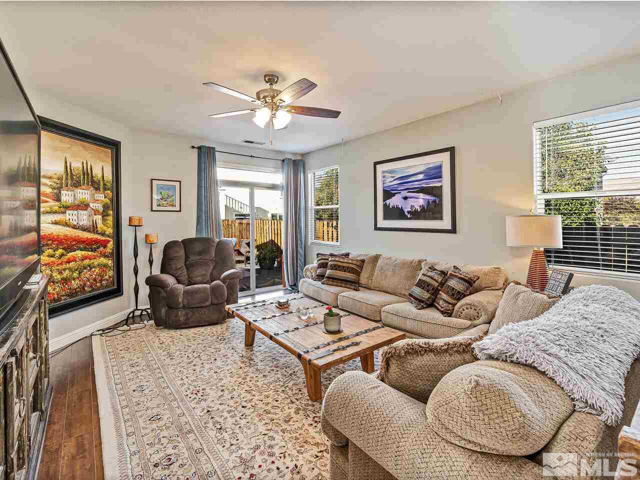 2289 Rio Lobo Lane Reno, NV 89521 - Photo 7 of 17 a living room with furniture and a flat screen tv