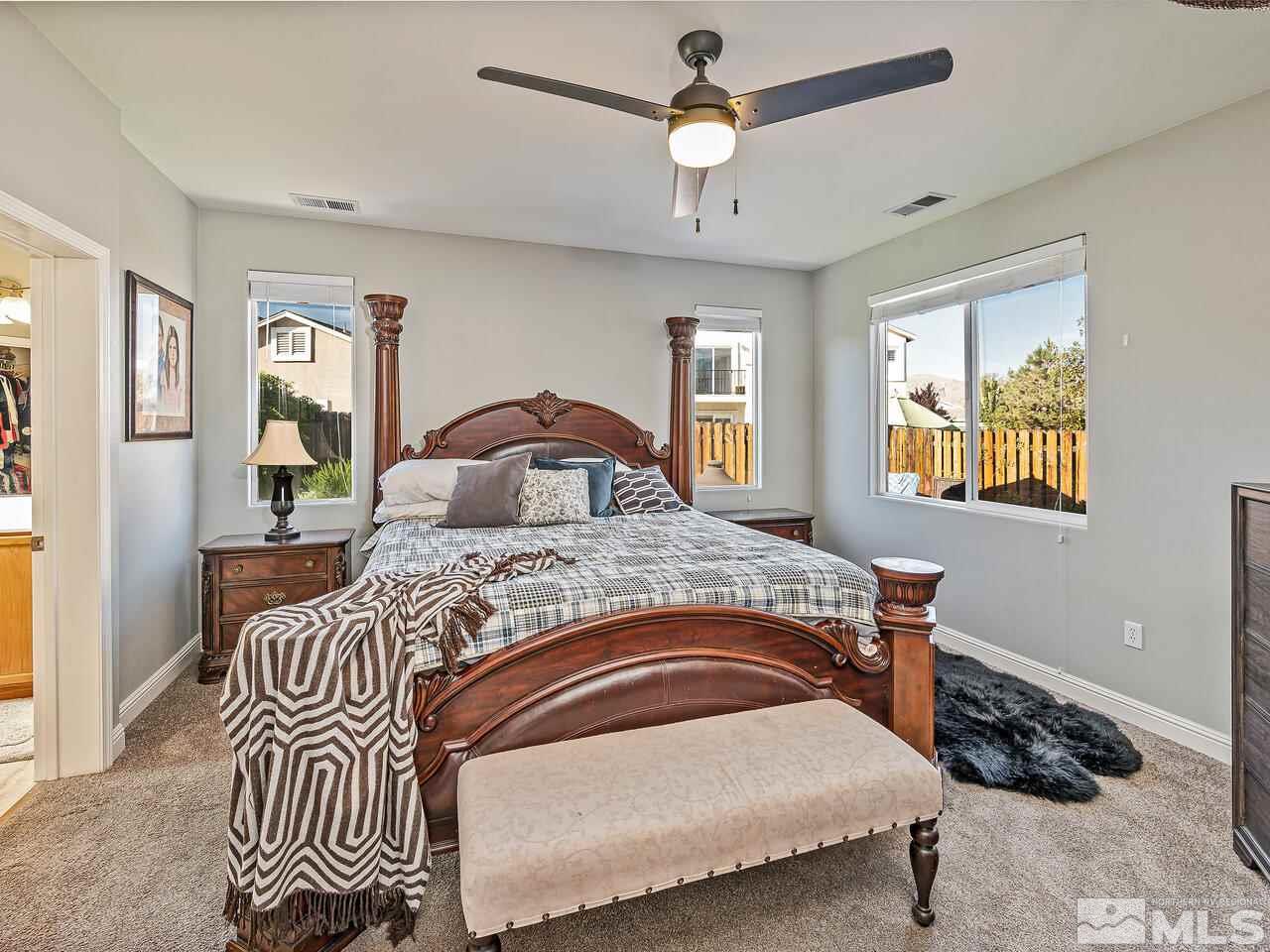 2289 Rio Lobo Lane Reno, NV 89521 - Photo 9 of 17 a bedroom with a bed and wooden floor