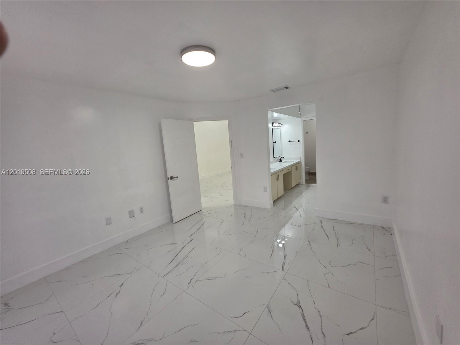 14775 Southwest 83rd Lane, Unit 14775 Miami, FL 33193 - Photo 13 of 26 master bedroom view to entry door and bathroom
