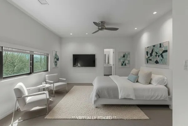 an empty room with windows and entrance