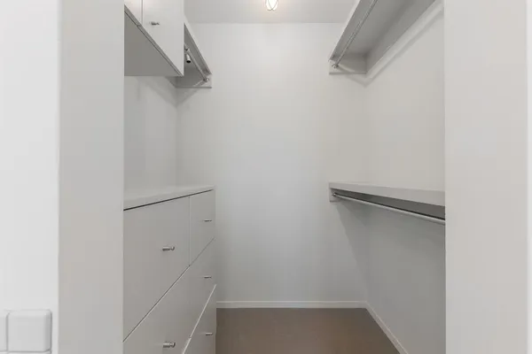 a bedroom with a bed and a couch