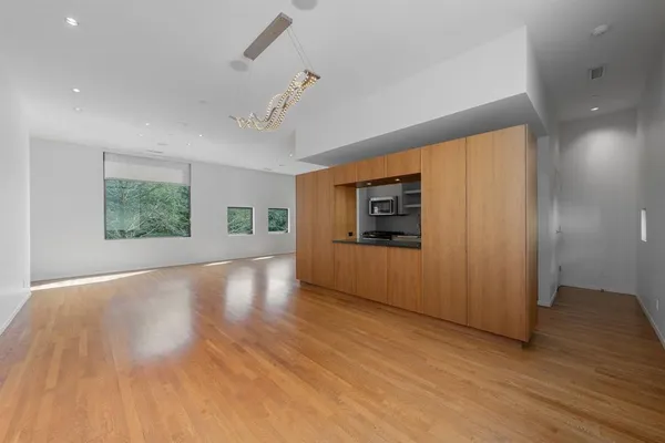 a living room with fireplace furniture and a wooden floor
