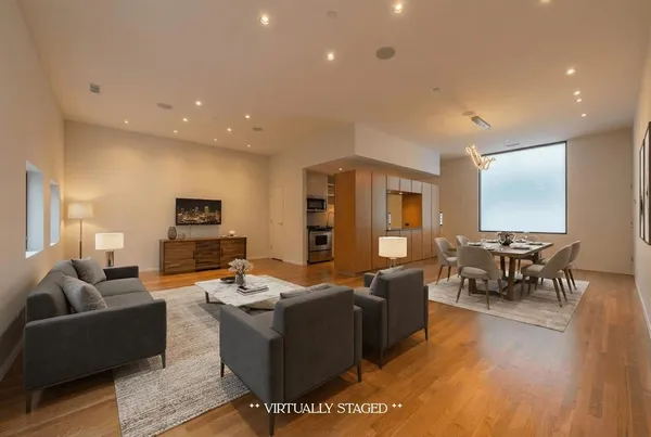 a view of a livingroom with wooden floor