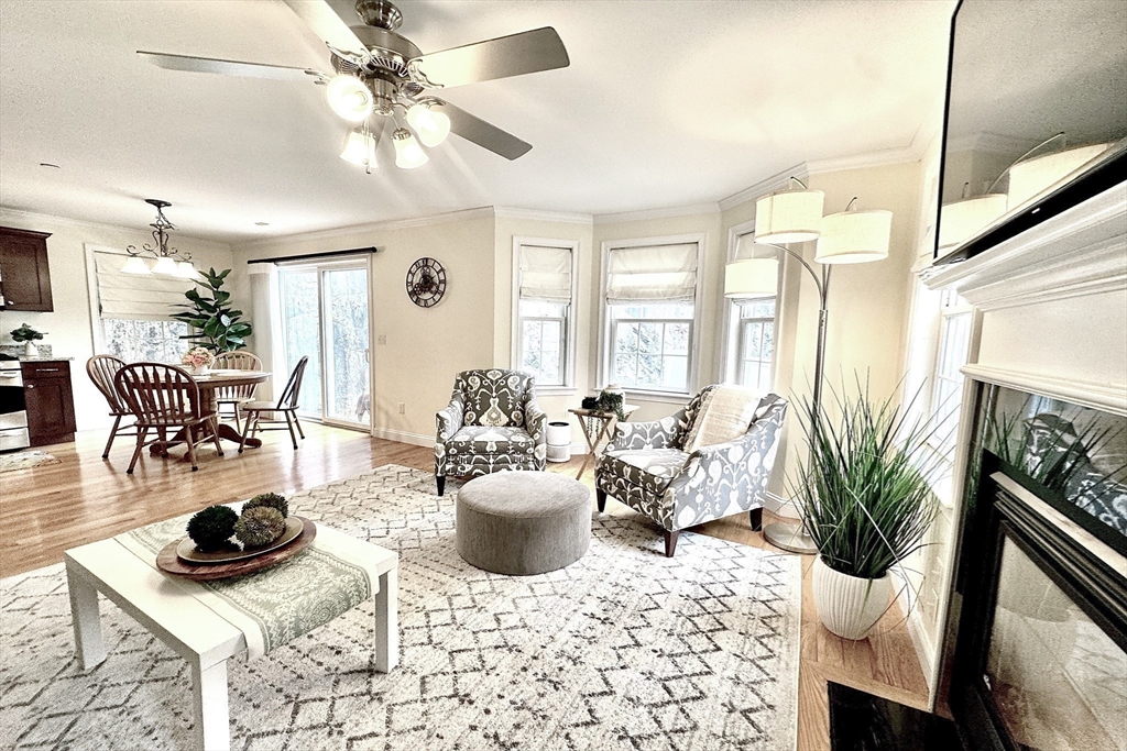 2 B Gates Lane, Unit B Wakefield, MA 01880 - Photo 9 of 42 a living room with furniture a rug and a chandelier