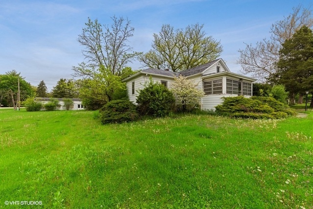 3610 York Road Oak Brook, IL 60523 - Photo 1 of 9 a front view of a house with a yard