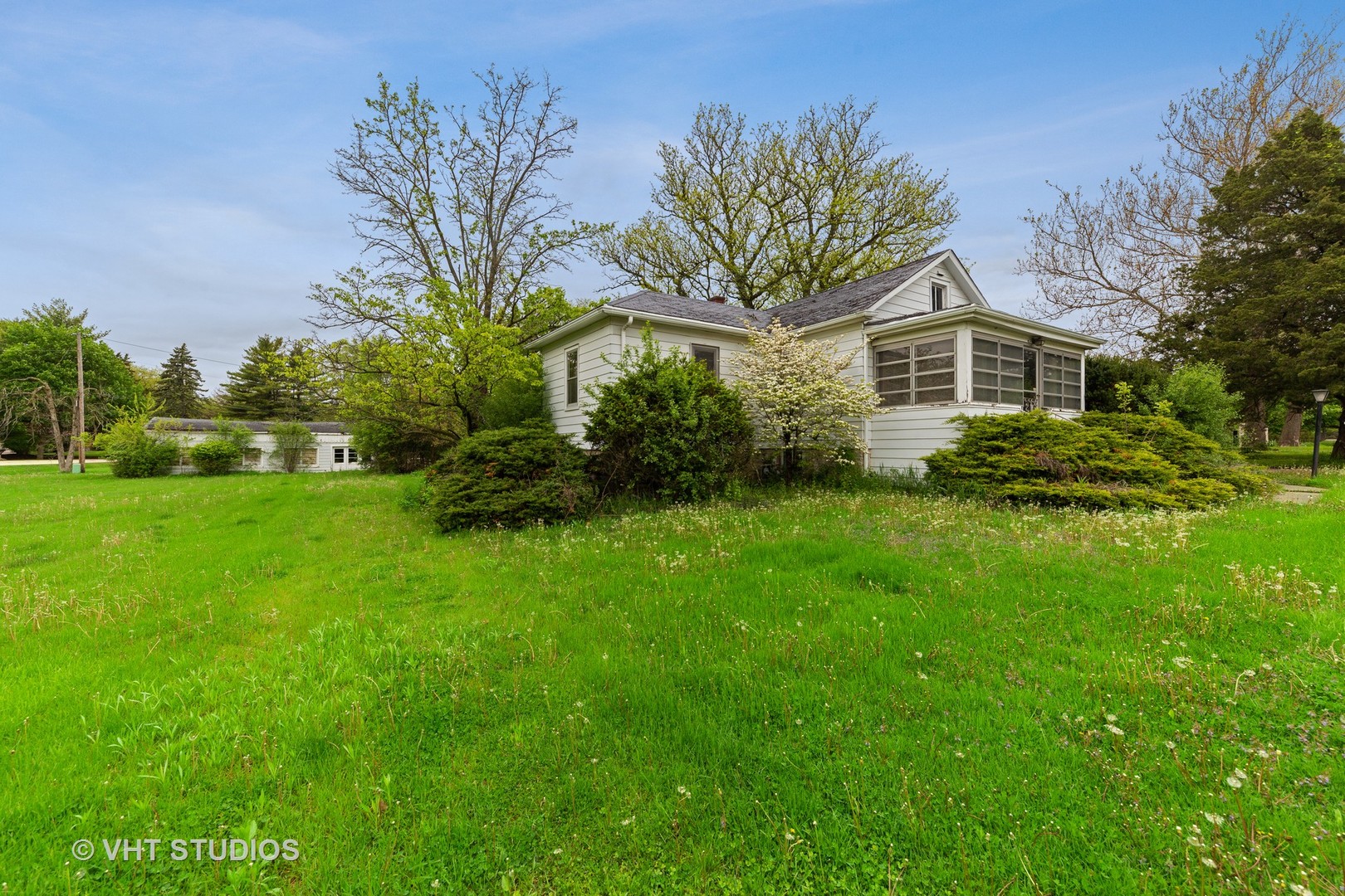 3610 York Road Oak Brook, IL 60523 - Photo 2 of 9 a front view of a house with a yard