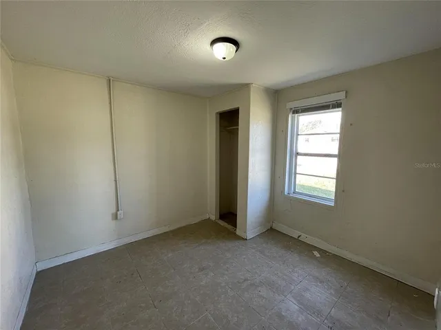 a bathroom with a toilet and a bathtub