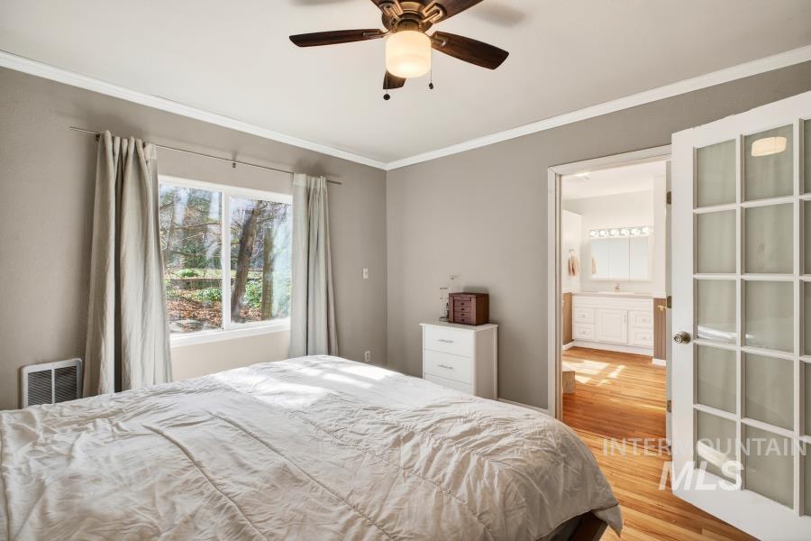 515 East D Street Moscow, ID 83843 - Photo 16 of 29 Bedroom with light wood-type flooring, crown molding, and ceiling fan