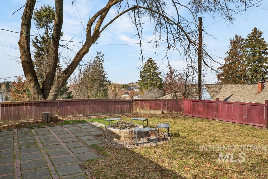 515 East D Street Moscow, ID 83843 - Photo 29 of 29 Fenced backyard featuring a fire pit and a patio area