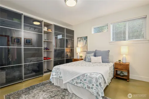 a bed room with a bed and a television