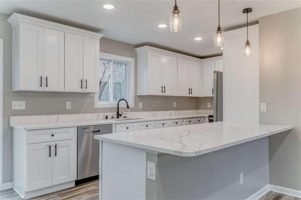 197 Colquitt Road Cedartown, GA 30125 - Photo 11 of 62 a kitchen with a sink stove and cabinets