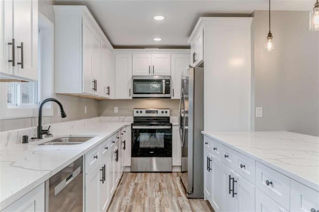 197 Colquitt Road Cedartown, GA 30125 - Photo 13 of 62 a kitchen with stainless steel appliances granite countertop a sink stove and refrigerator