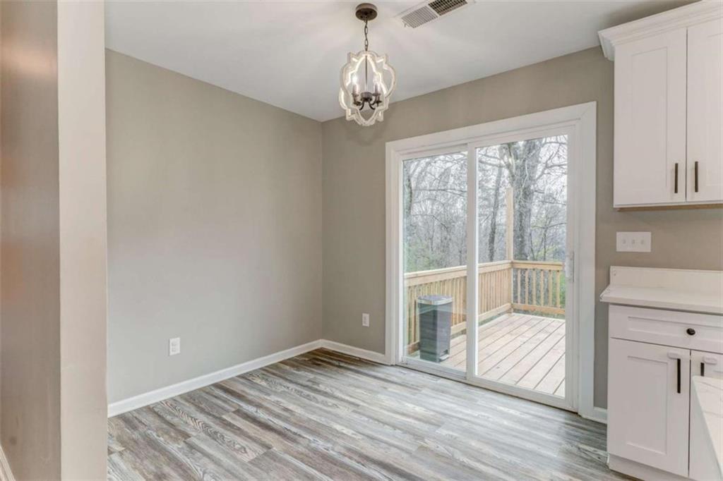197 Colquitt Road Cedartown, GA 30125 - Photo 22 of 62 a view of a livingroom with wooden floor and windows
