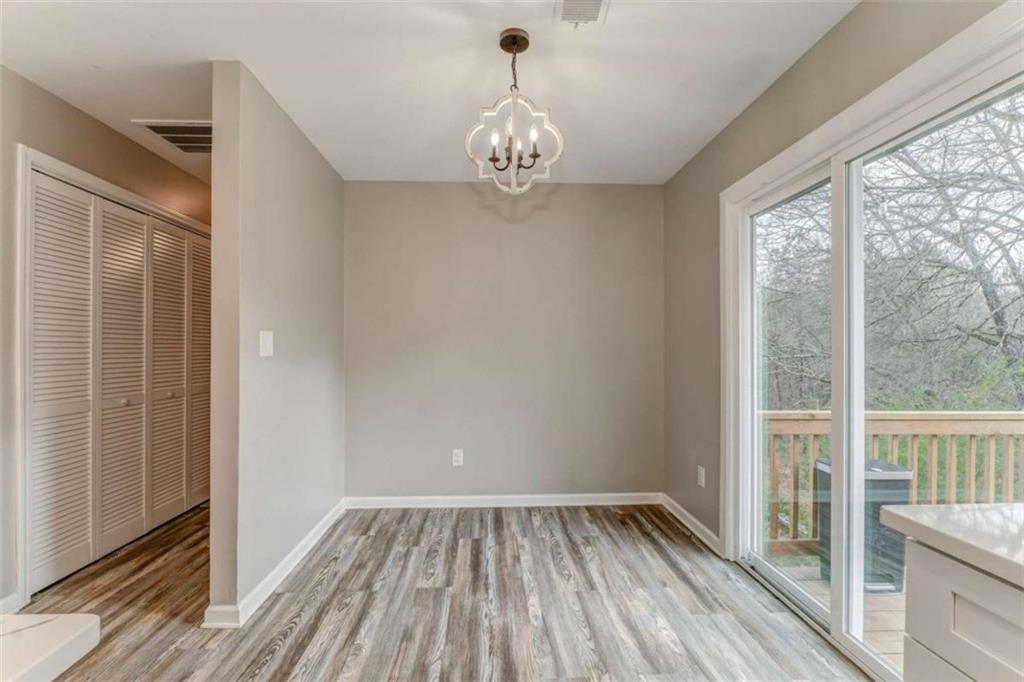 197 Colquitt Road Cedartown, GA 30125 - Photo 23 of 62 a view of empty room with wooden floor and fan