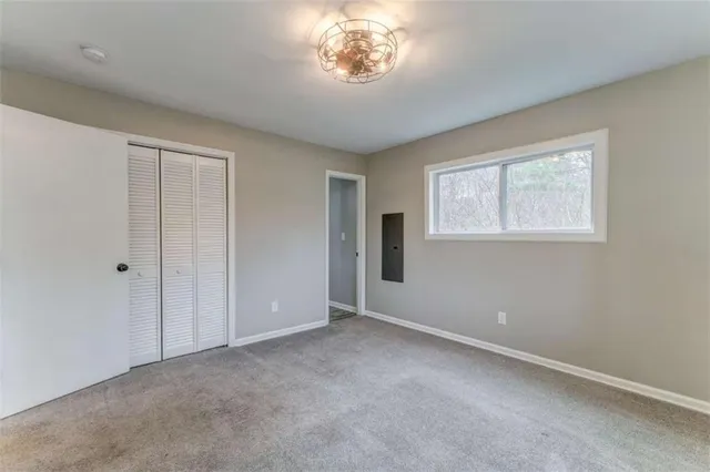 a bathroom with a toilet a sink and a shower curtain