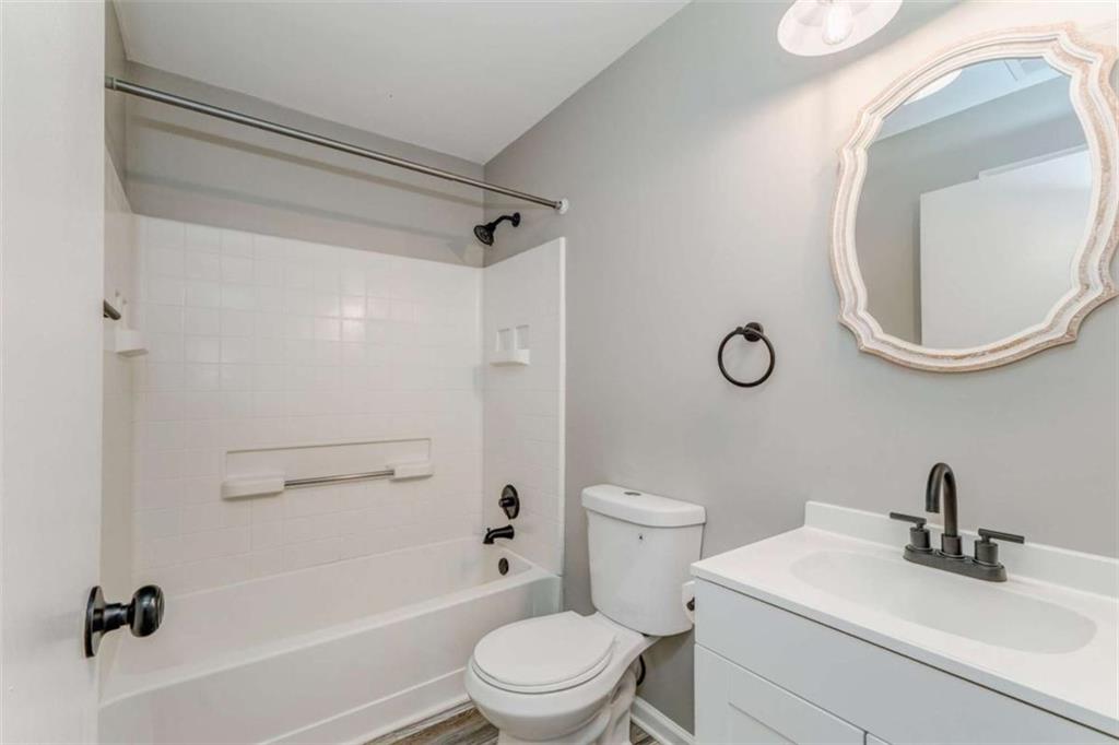 197 Colquitt Road Cedartown, GA 30125 - Photo 30 of 62 a bathroom with a sink a toilet and a mirror