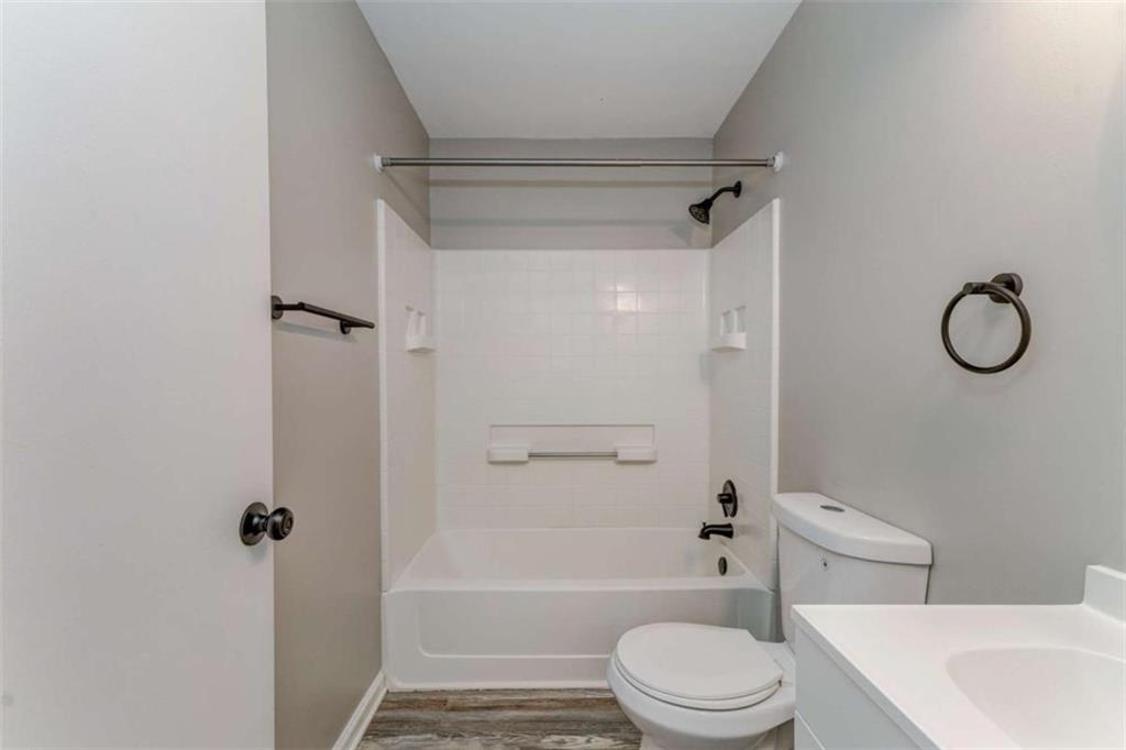197 Colquitt Road Cedartown, GA 30125 - Photo 31 of 62 a bathroom with a granite countertop bathtub shower sink vanity and toilet